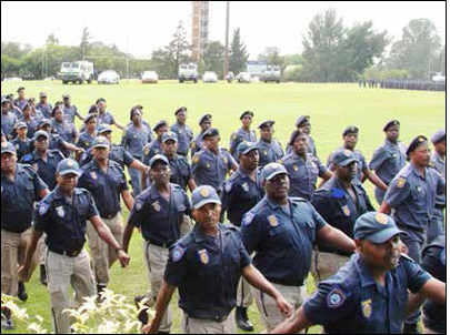 Metro Police officers and members of the SAPS Tactical Response Team participate in a passing-out parade after completing a course in crowd management.