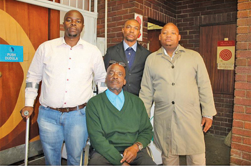 Mbongiseni Mabaso (right), Cornelius Monama from the Department of Small Business Development, Mduduzi Jijana and Sipho Mdletshe (sitting) at the Disability Engagement Session in Pinetown.