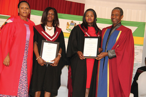 MEC Sibongiseni Dhlomo (far right) and KZN Nursing College principal Sindizama Mthembu (far left) congratulate top achievers Joyce Oduro and Nonkululeko Buthelezi.