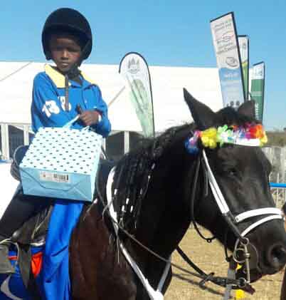 Anothe Buthelezi riding Blackberry after the Dundee July horse racing event.